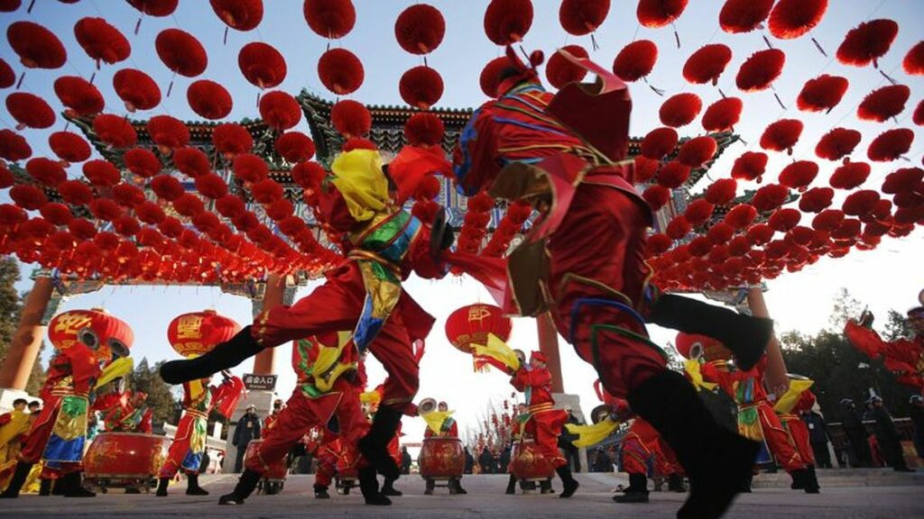 Traditional dancers perform during the opening of the temple fair for the Chinese New Year celebrations at Ditan Park in Beijing
